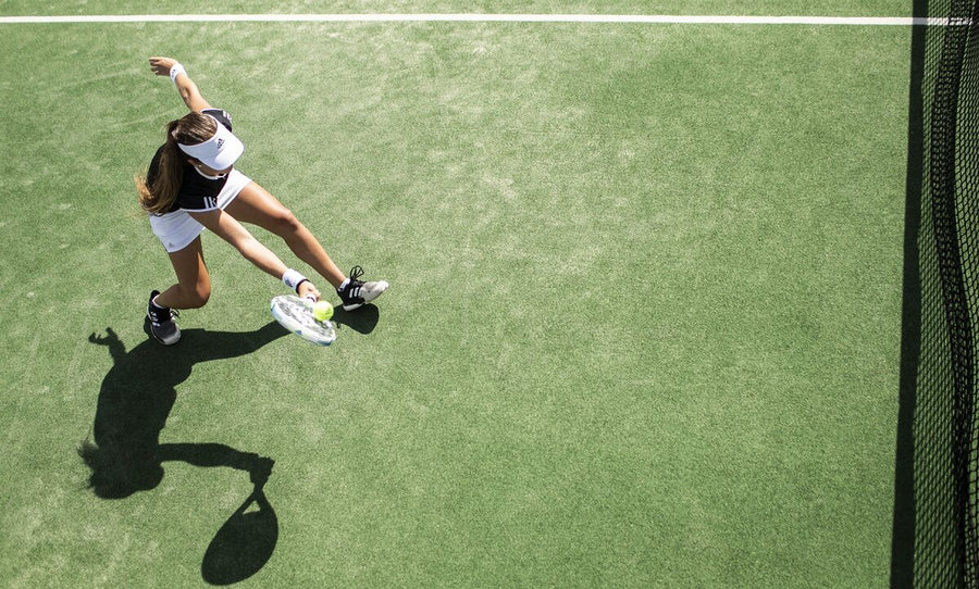 A woman hitting a tennis ball