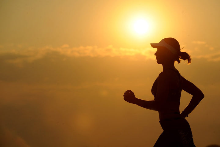 Woman jogging with a hat