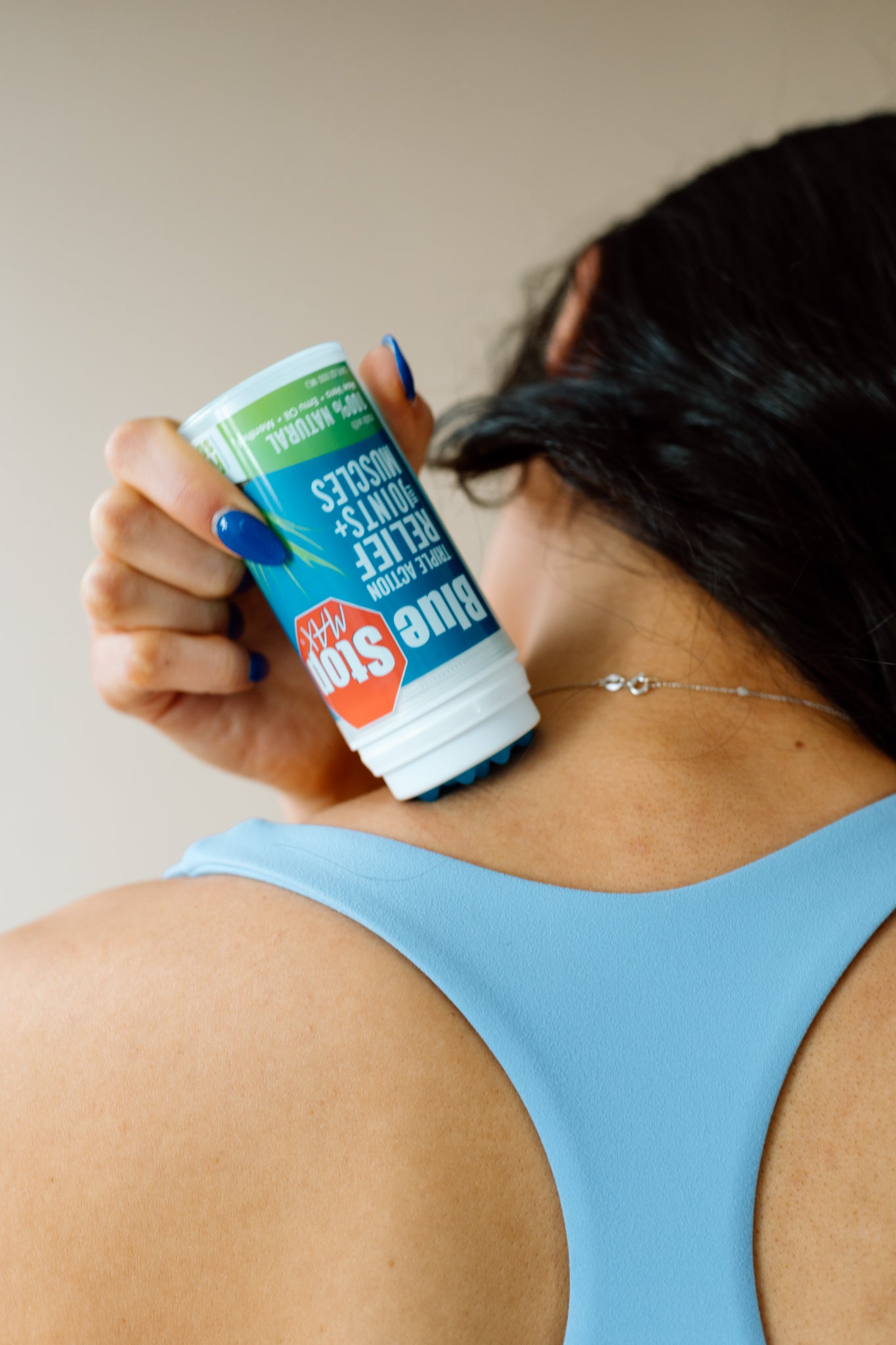 Blue Stop max product applying on her nape